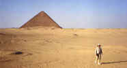 Red Pyramid and person doing a desert walk