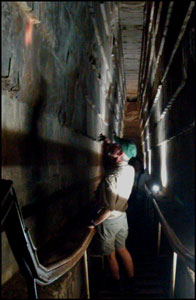 Tom Ross examining the walls of the Grand Gallery, Great Pyramid of Giza
